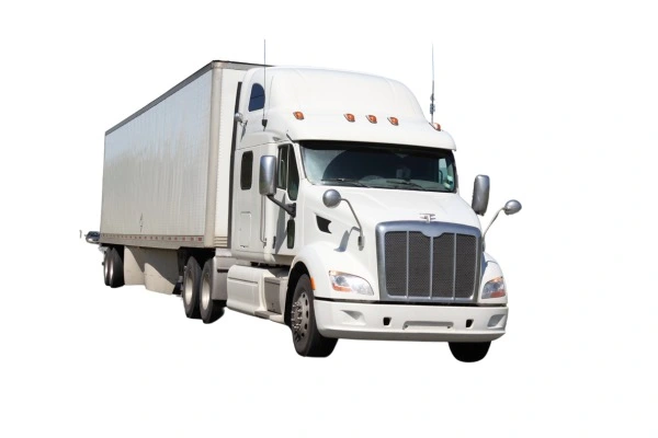 A white semi-truck with a sleeper cab and a large enclosed trailer, typically used for long-haul deliveries. The truck has a distinctive grille design indicating it might be a model from the Peterbilt or Kenworth brand, isolated on a white background with no visible company markings or logos.